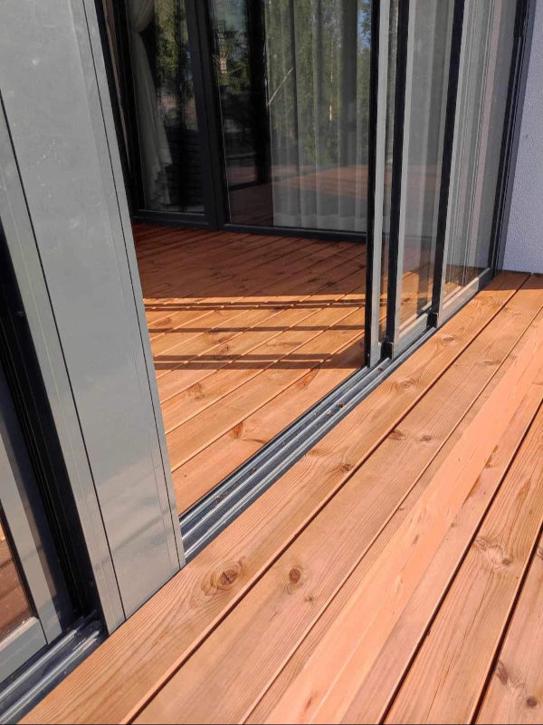 glass room wood decking MGE